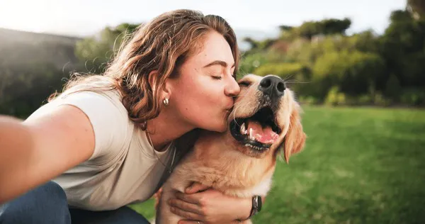 woman-kiss-selfie-dog-on-600nw-2575882875